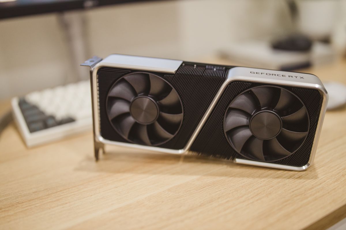 GeForce RTX graphics card with two cooling fans on a desk